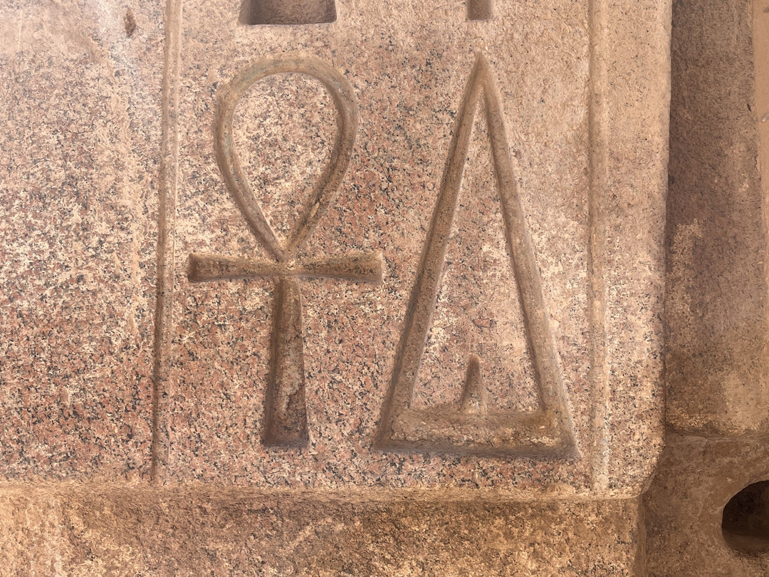 Decoding Ancient Symbols: The Meaning of the Ankh and the Giving Hieroglyph in Egyptian Art